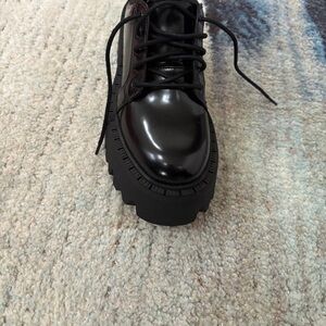 Black women’s combat style shoe with platform heel
